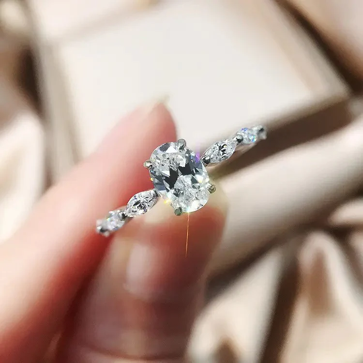 Oval Cut Moissanite Engagement Ring with Marquise Sides 18K Gold - Image 10